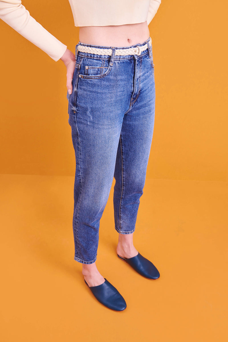 Model wearing handmade Mules women's slip-on leather sandals in mediterranean / MEDITERRANEAN