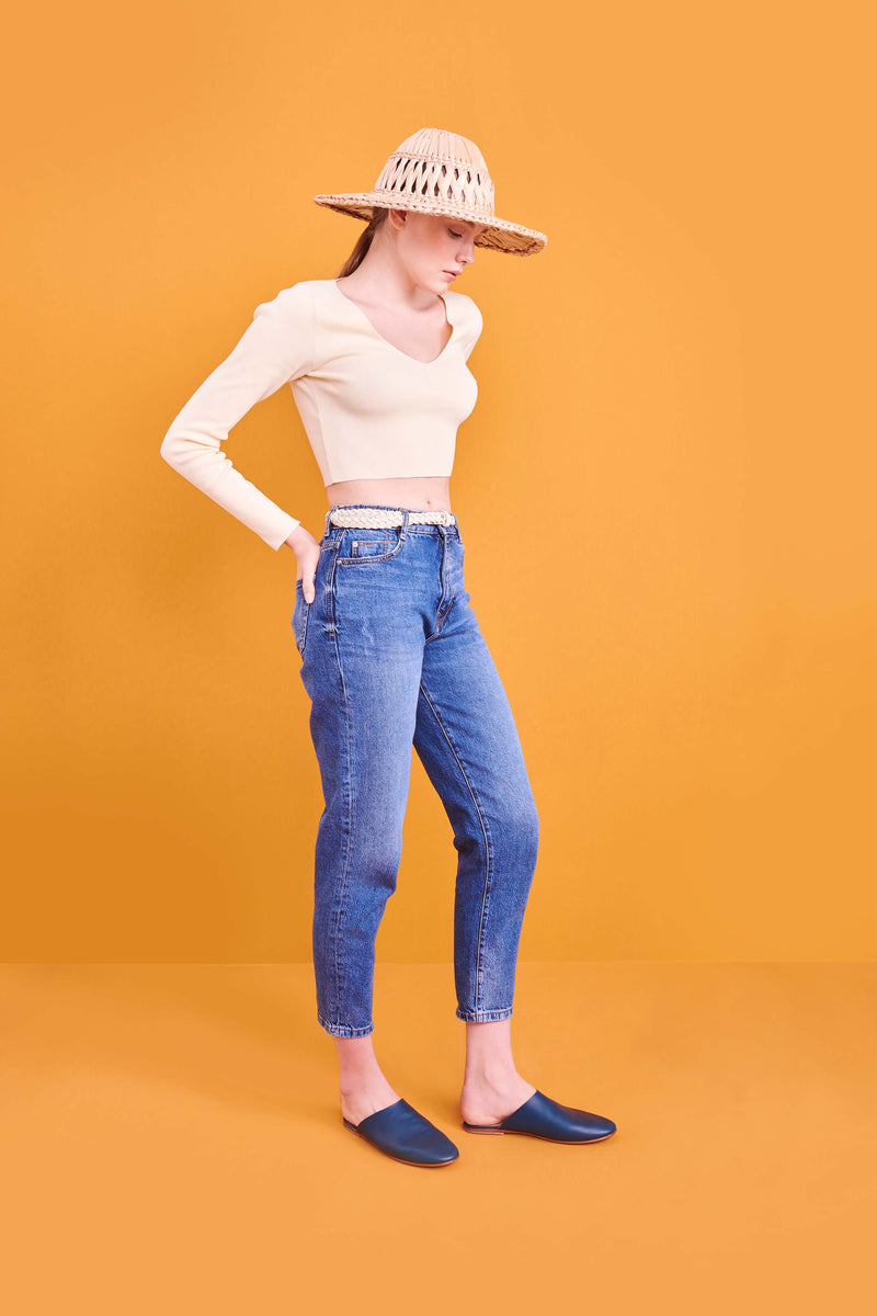 Model wearing handmade Mules women's slip-on leather sandals in mediterranean / MEDITERRANEAN